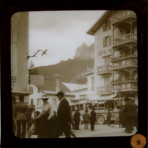 Street scene in town surrounded by mountains