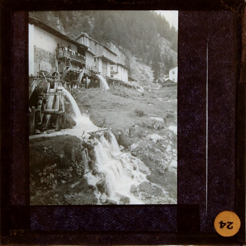 Sequence of water mills in Alpine landscape