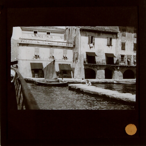 Boats and jetty in unidentified Italianate town