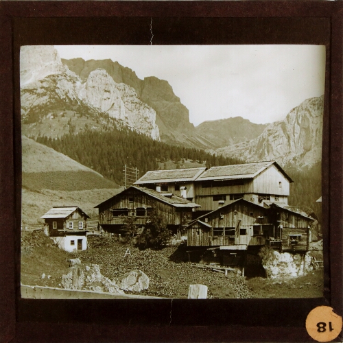 Group of chalet-style buildings in mountain landscape