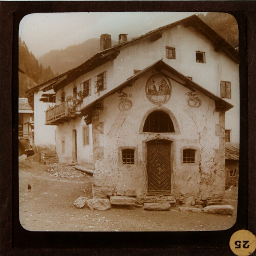 Decorated building in village in mountainous landscape