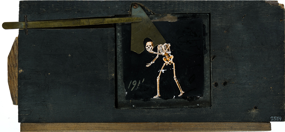 Skeleton removing its skull