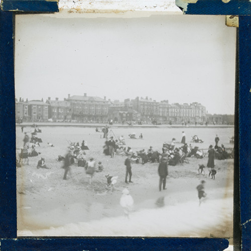 People on beach in unidentified seaside town