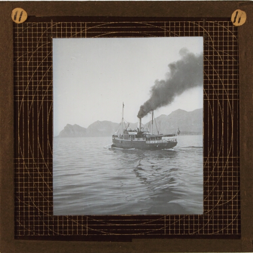 Steamship moving in sea or fjord