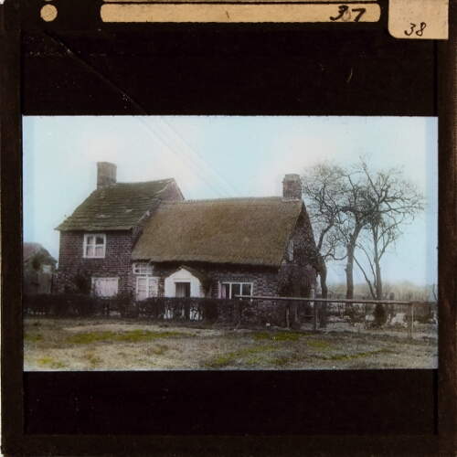 Cottage in rural landscape