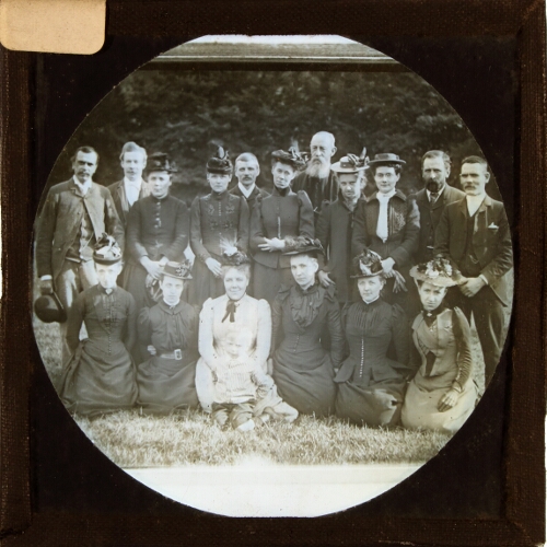 Group of men and women posing for photograph