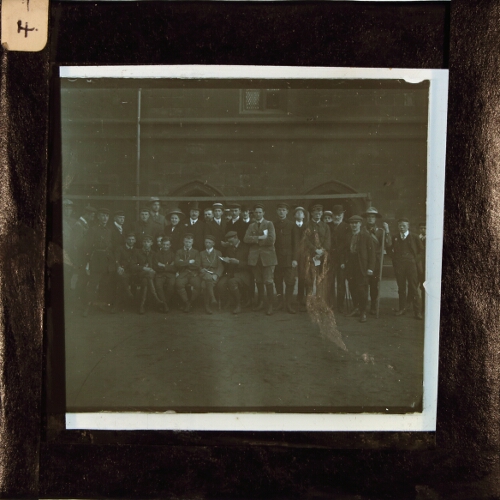 Group of men, woman and boys posing at Chetham's School