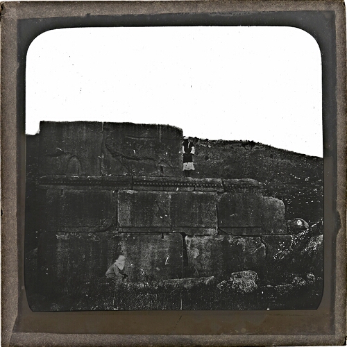 Ancient ruins with man standing on wall