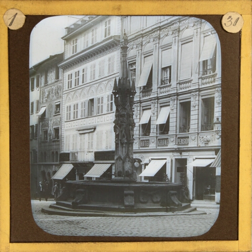 Fountain in street of unidentified town or city