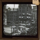 [Large buildings around square in unidentified city or town]