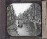 Canal in unidentified city – Rear view of slide