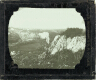 [View over valley with cliffs and railway track]