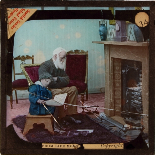 Willie sat by the fire with a picture-book on his knee