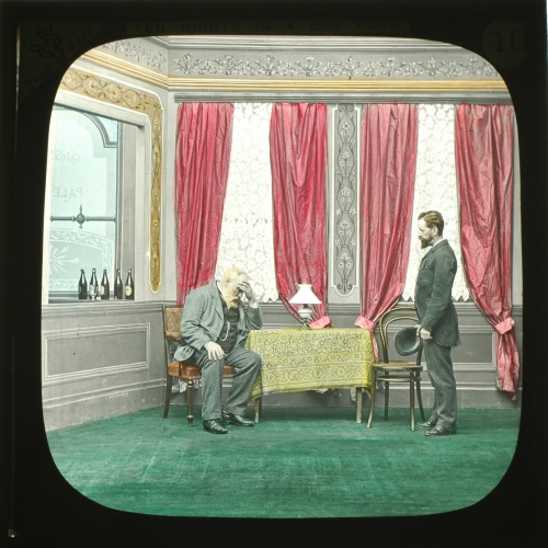 In Parlour -- Landlord seated with Lamp
