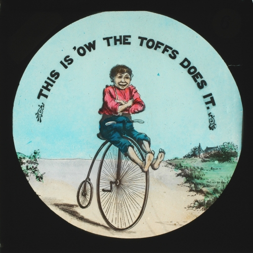 Slide showing boy riding bicycle