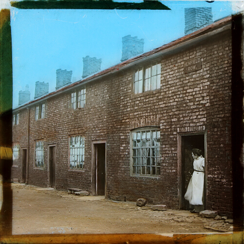 Woman standing in doorway, Henfield Row