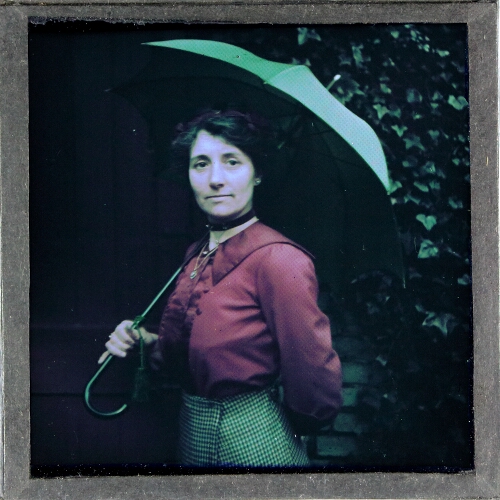 Portrait of woman with umbrella – secondary view of slide