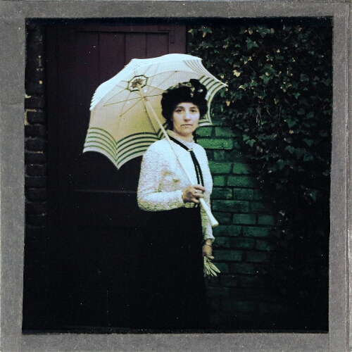 Portrait of woman with umbrella – secondary view of slide