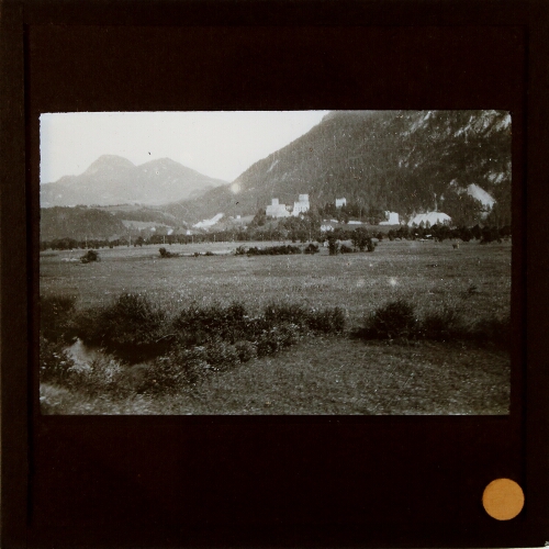 Distant view of castle in valley in mountainous region