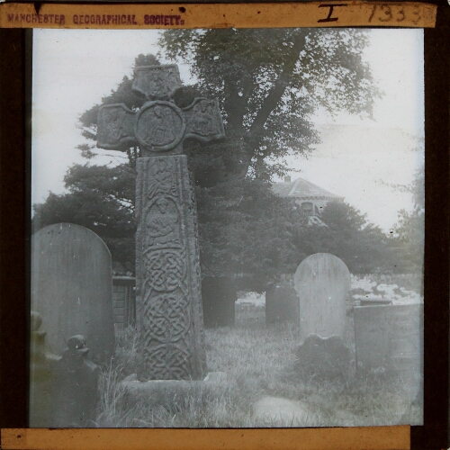 Stone cross in graveyard