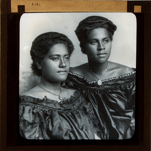 Two Fijian women wearing western dresses