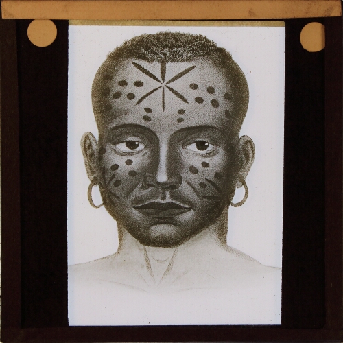 Face of native man with tattooed pattern