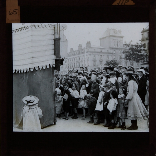 Group of children watching Punch and Judy show