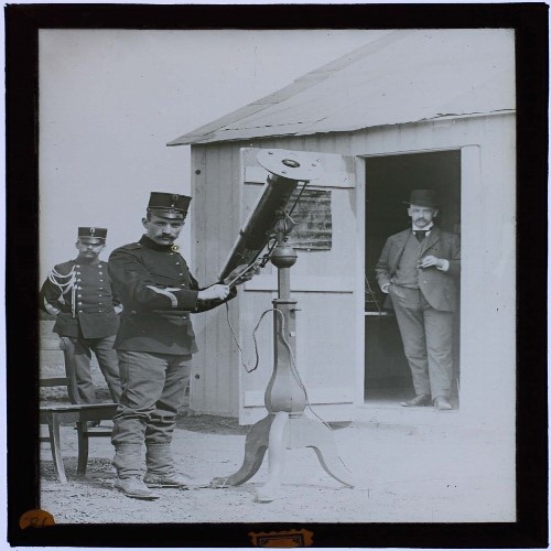 three researchers / uniformed men with instrument