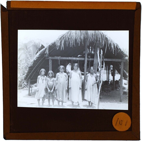 group of people in front of hut