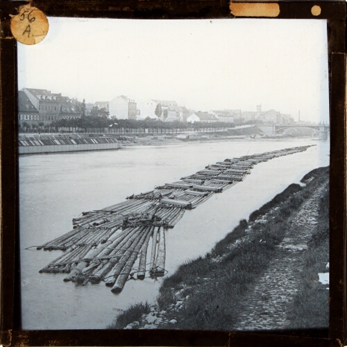 Rafts of logs floating in river