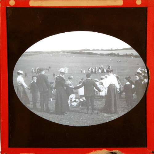 Group of adults and children in field
