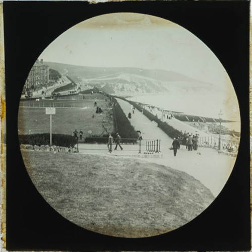 Promenade and cliffs in unidentified seaside town