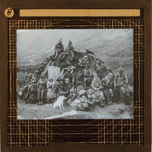 Group of native people sitting on dwelling