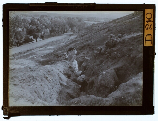 Student at an eroded hill
