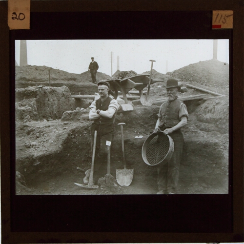 Men with tools on archaeological site