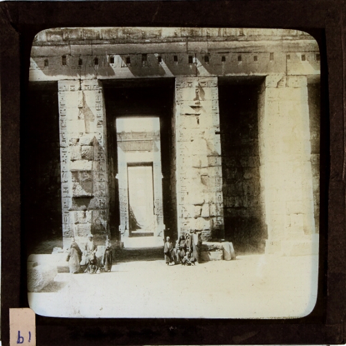 People standing at entrance to ancient Egyptian temple