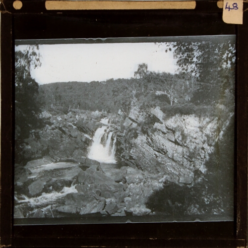 Waterfall and rock escarpment