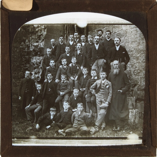 Group of men and boys posing for photograph