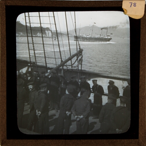 Crew members parading on deck of sailing ship