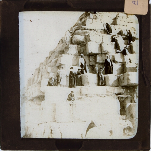 Group of people standing on Egyptian pyramid