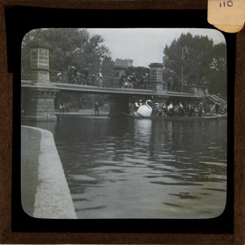 Bridge over lake in park in unidentified city