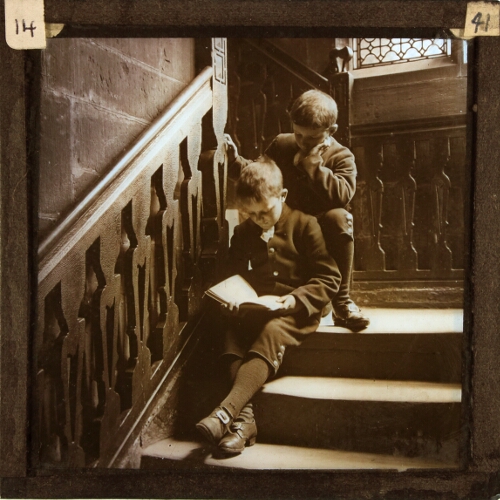Two schoolboys reading on staircase, Chetham's Hospital