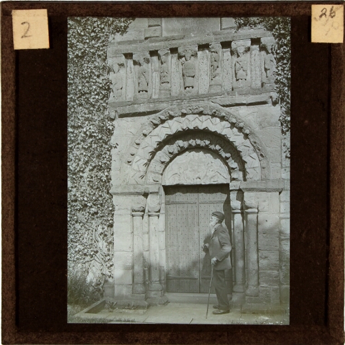 Old man standing by Norman Chapel, Prestbury Church