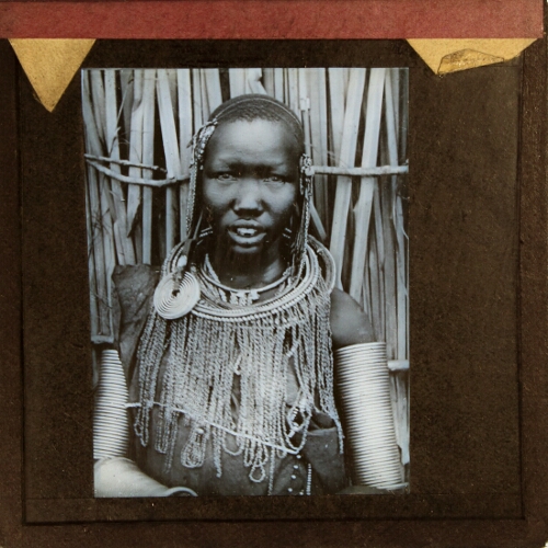 African person with necklace and arm adornments