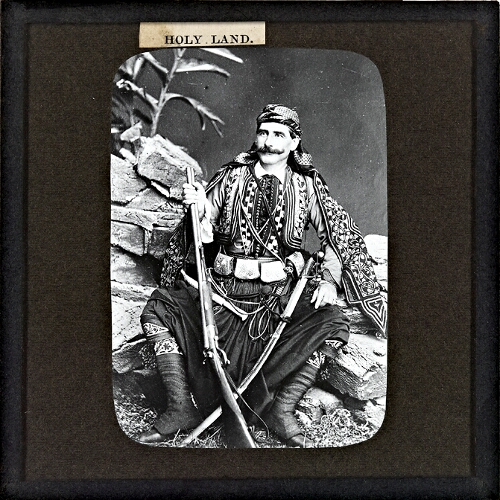 Man with rifle and sword
