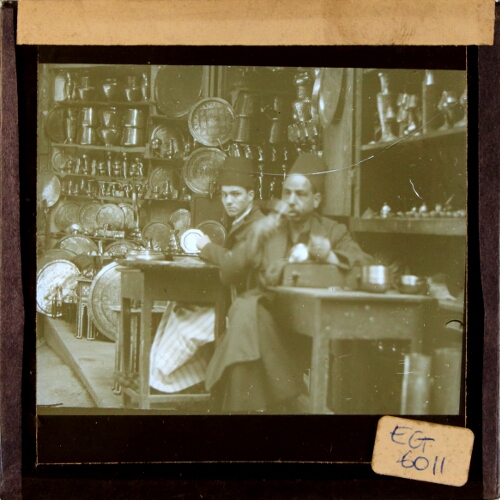 Two men working in metalware shop