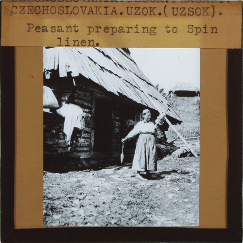 Czechoslovakia, Uzok (Uzsok) -- Peasant preparing to Spin linen