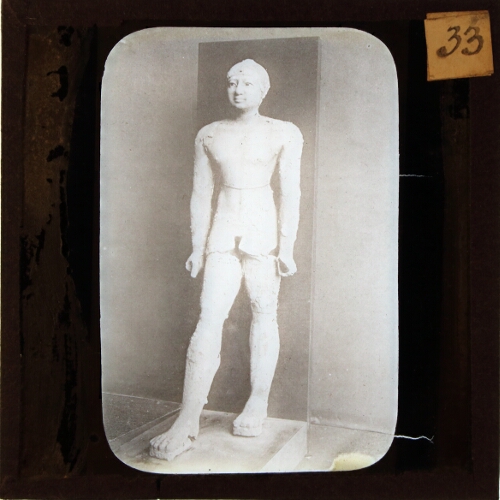Statue of man walking