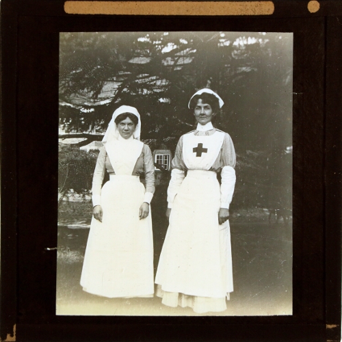 Two nurses standing in gardens of Alderley Park