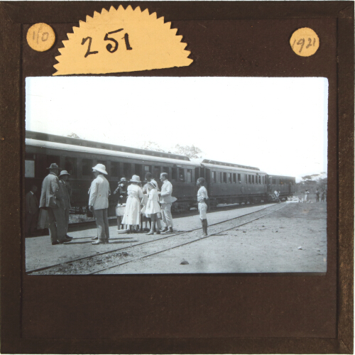 Group of people at refreshment table by side of Rhodesia Railways train